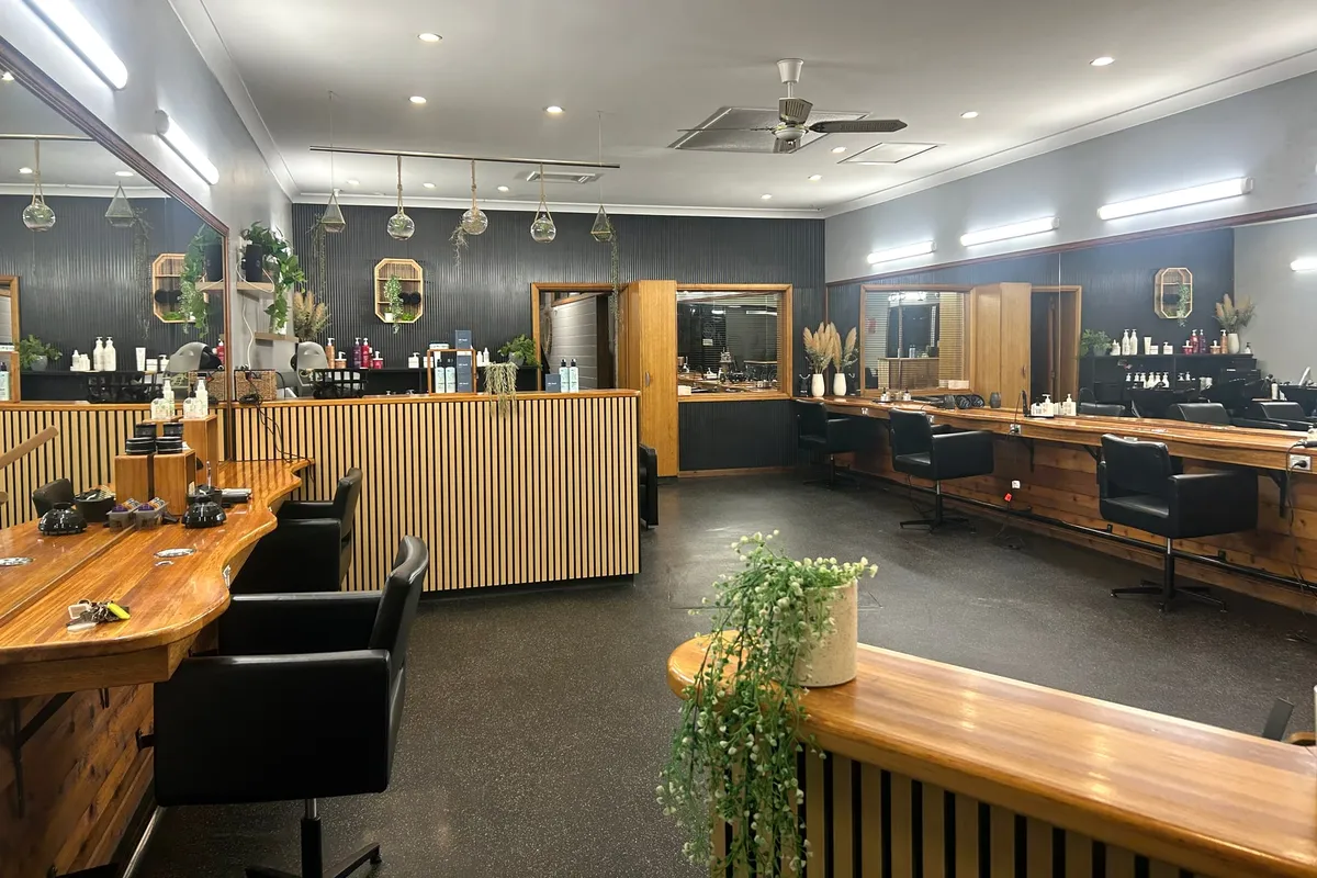 The styling floor at Smithton Haircare Studio, looking across the mirror stations and reception counter